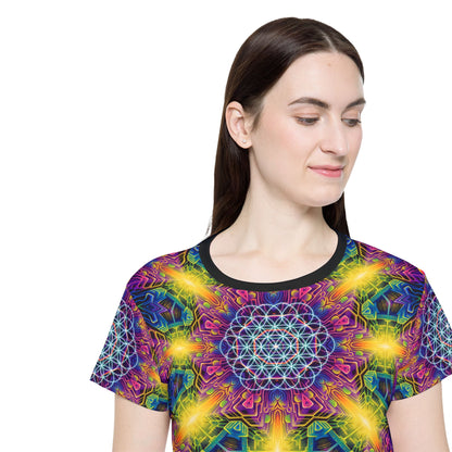 Women's sport tee in the DMandalaT psychedelic mandala all-over print design, laid flat.