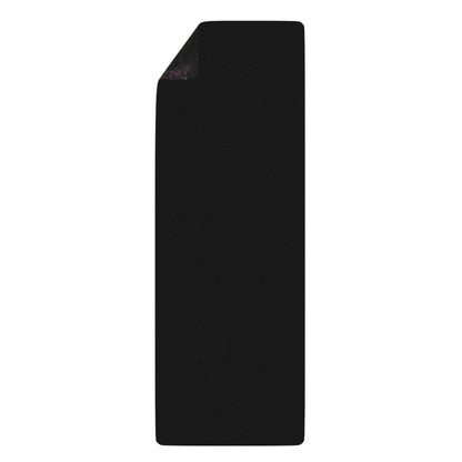 The corner of the Remnant yoga mat curled up, showing the microfiber suede top and mat thickness.
