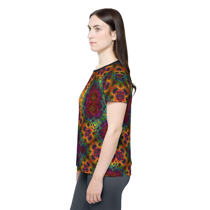 Corner detail of the Lysergic Burst women's sport tee showing the print and seam.