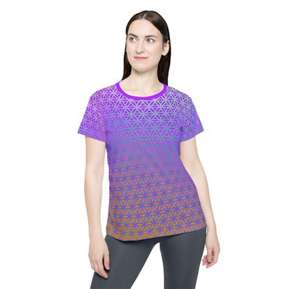 Women's sport tee in the Flower de Life V2 sacred geometry all-over print design, angled view.