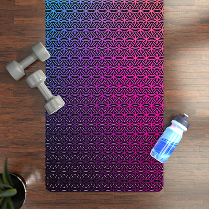 Angled view of the Rainbow Flower of Life Mandala yoga mat resting on a floor.