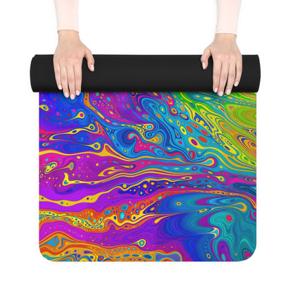 Rolled UV Bleed yoga mat held in two hands with the black rubber back facing out.