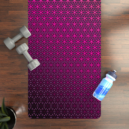 Pink Flower of Life yoga mat on a wood floor styled with dumbbells and a water bottle