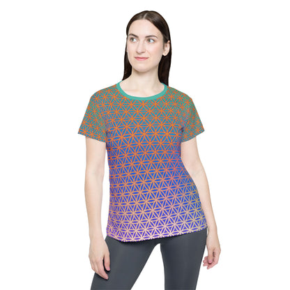 Women's sport tee in the Flower de Life sacred geometry all-over print design, angled view.