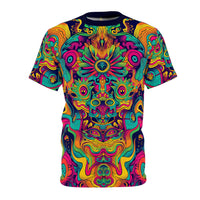 Front flat lay of the Totem tee showing a symmetrical psychedelic print in teal, pink, and gold on navy fabric.