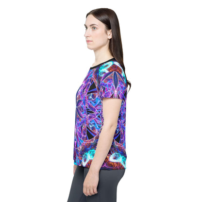 The "Flower of Life Mandala" women's sport tee photographed from above on a flat surface.