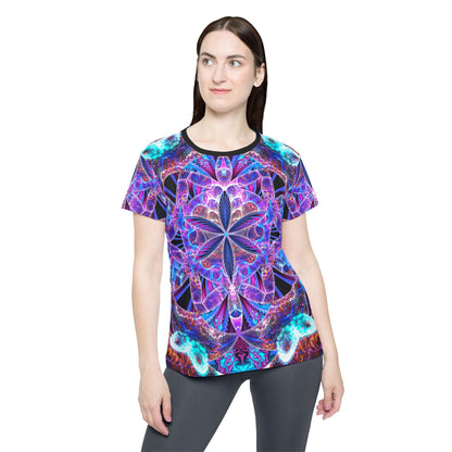 Angled view of the women's sport tee highlighting the "Flower of Life Mandala" design colors.