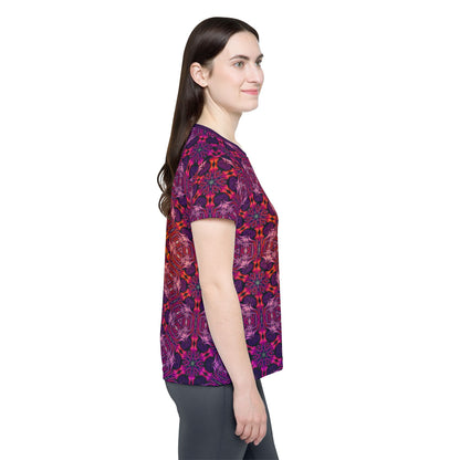 Folded view of the "Forged In Neon" women's sport tee showing the printed design.