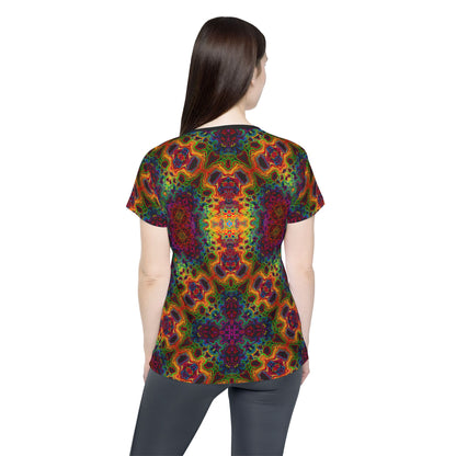 Overhead view of the Lysergic Burst women's sport tee laid flat.