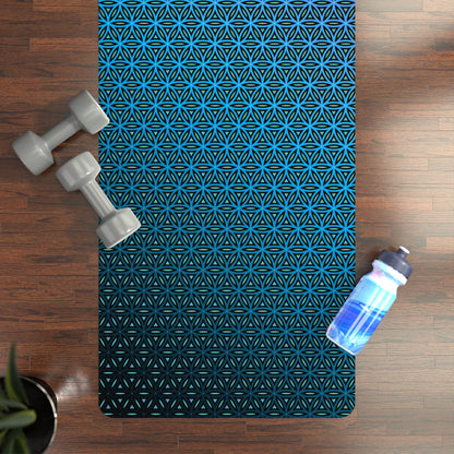Angled view of the Blue Flower of Life yoga mat resting on a floor.