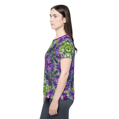 Women's sport tee in the Emergence Pattern psychedelic all-over print design, shown from above.