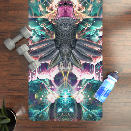 Nectar yoga mat on a wood floor next to dumbbells and a water bottle, showing the hummingbird print.