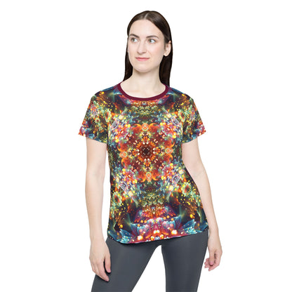Angled view of the "Kaleidobloom" print women's sport tee.