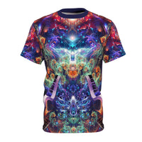 Front flat lay of the Magnus Opum tee with a glowing angel, red floral mandala, and piano keys in a cosmic fractal print.