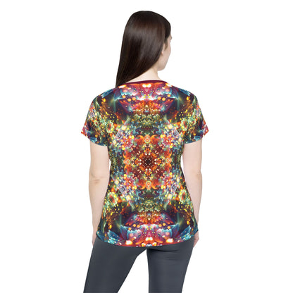Corner detail of the "Kaleidobloom" print women's sport tee.