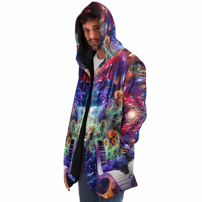 Male model wearing the "Magnus Opum" hooded cloak, side profile from the left.
