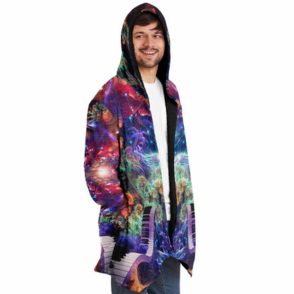 Male model wearing the "Magnus Opum" hooded cloak, side profile from the right.