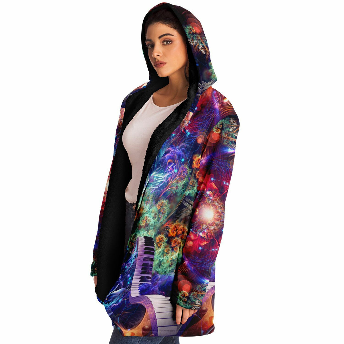Female model wearing the "Magnus Opum" hooded cloak, side profile from the left.