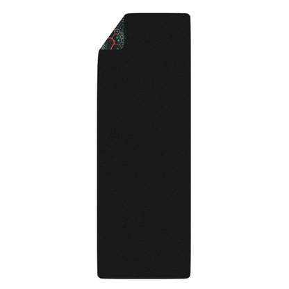 Two hands rolling up the 'Multiverse' yoga mat.