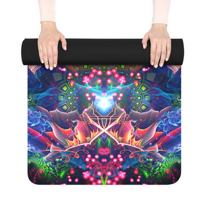 Hands rolling up the Hunter's Moon yoga mat, its black rubber back on top and colorful print beneath.