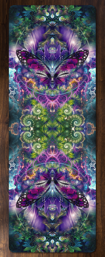 "Emergence" yoga mat laid flat on a wood floor, showing the full mirrored purple and green butterfly fractal design.