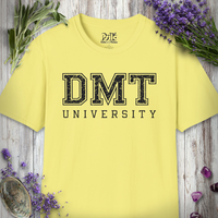 Pale yellow DMT University t-shirt laid flat on wood with lavender and sage sprigs nearby.