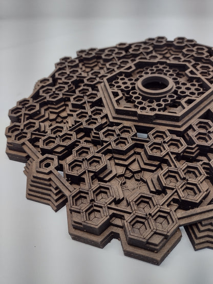 The Fractalgon wall art crystal grid hanging on a wall by its keyhole cutout.