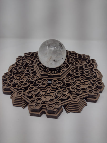 Angled view of the Fractalgon wall art crystal grid showing the laser-cut hexagon detail.