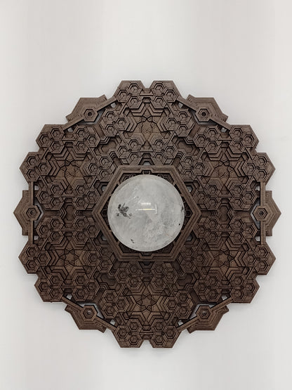 The Fractalgon wall art crystal grid laid flat on its raised wooden feet.