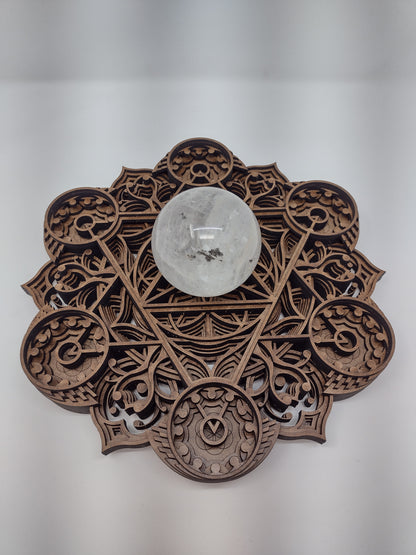 The Harvest Abundance wall art crystal grid mounted on a wall, keyhole cutout visible.