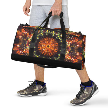 White duffle bag printed with the "Autumn Bloom" design, front view showing the zip pocket and handles.