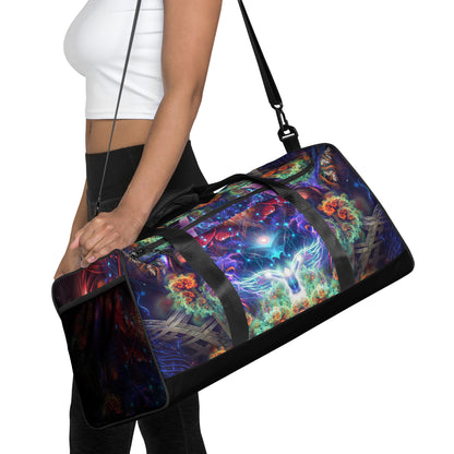 White duffle bag printed with the "Magnus Opum" design, front view showing the zip pocket and handles.