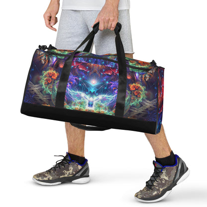 White duffle bag printed with the "Magnus Opum" design, front view showing the zip pocket and handles.
