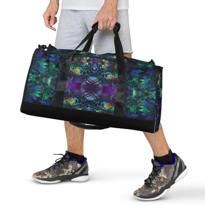 White duffle bag printed with the "Awakened" design, front view showing the zip pocket and handles.