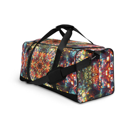 Angled left-front view of the Kaleidobloom duffle bag showing the print wrapping around the corner.