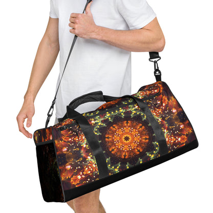 White duffle bag printed with the "Autumn Bloom" design, angled front view showing the padded handles.