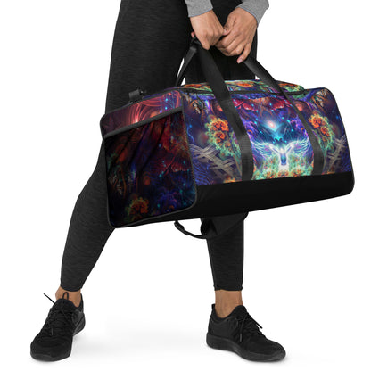 White duffle bag printed with the "Magnus Opum" design, angled front view showing the padded handles.