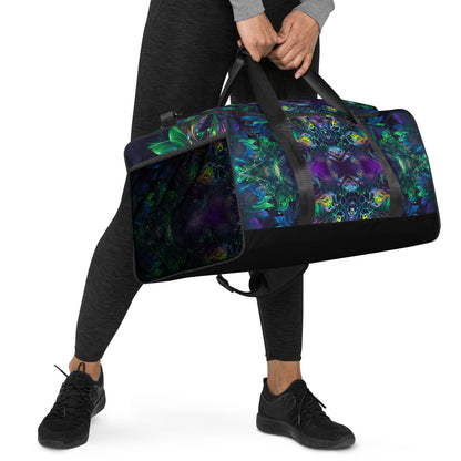 White duffle bag printed with the "Awakened" design, angled front view showing the padded handles.