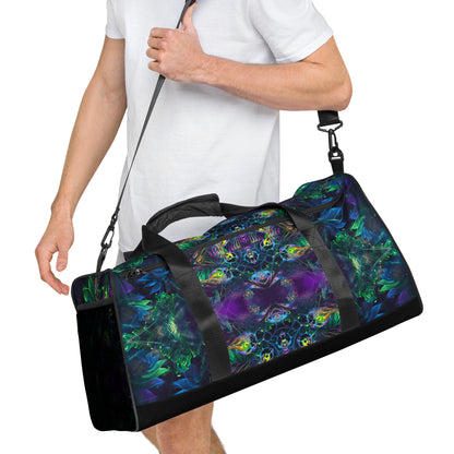 White duffle bag printed with the "Awakened" design, angled front view showing the padded handles.