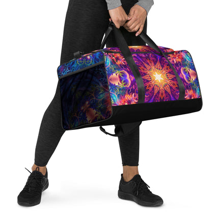 Right-front view of the Sacred Circle duffle bag with the removable padded shoulder strap attached.
