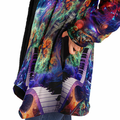 Close-up of the "Magnus Opum" hooded cloak fabric, showing the print detail up close.