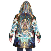 Back view of a man wearing the Density 432 hooded cloak, showing a glowing Om symbol and meditating figure.