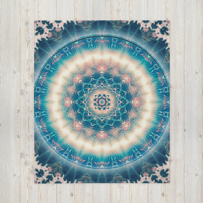 Front view of the "Triple Goddess" throw blanket print laid flat on the floor