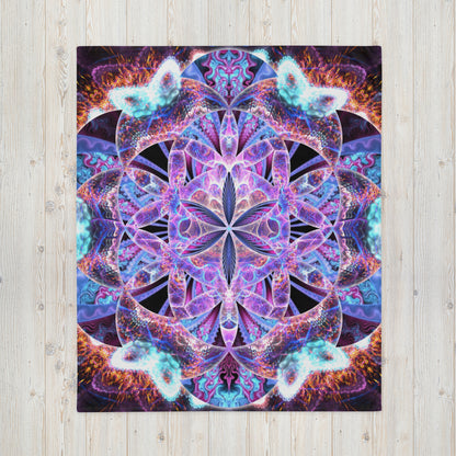 Another front view of the folded Flower of Life fractal mandala throw blanket showing the print in full.