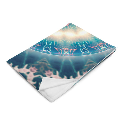 The "Triple Goddess" throw blanket folded at an angle, showing the print and white backing