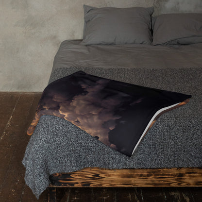 "Adieu" throw blanket folded at the foot of a bed, showing the soft texture.