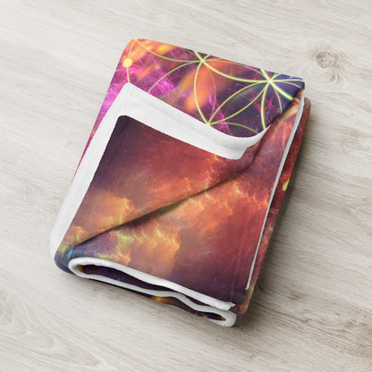 "Genesis" throw blanket styled across a bed, showing size and drape.