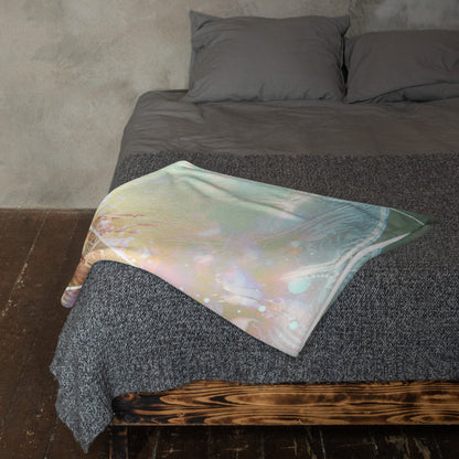 "Primordial Soup" throw blanket draped over the arm of a chair, showing the full print.