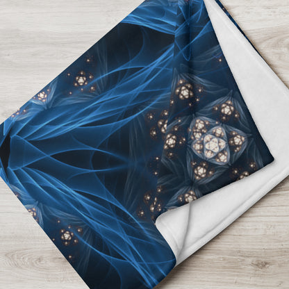 "Inner Sanctum" fractal mandala throw blanket draped over a couch in a living room.