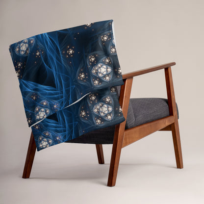 "Inner Sanctum" throw blanket styled across a bed, showing size and drape.